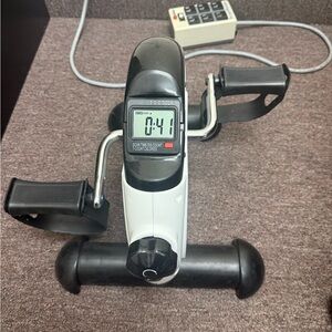 Compact Black and White Desk Pedal Exerciser